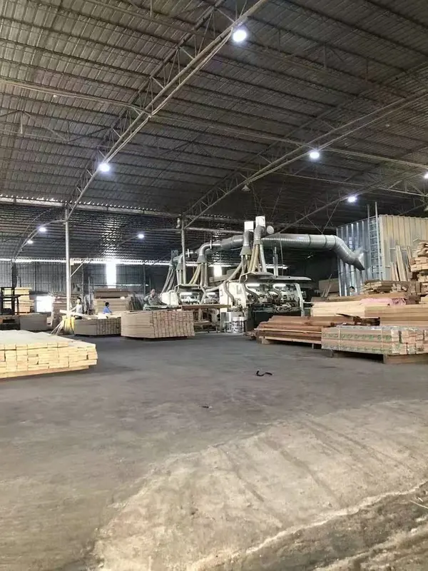 Machining line with dust-extraction ducting running overhead