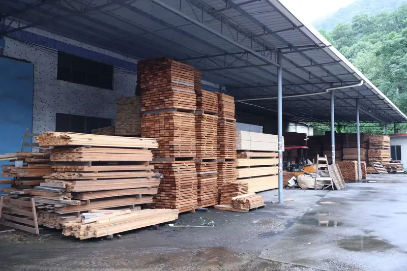 Kiln-dried timber boards stacked under the covered yard