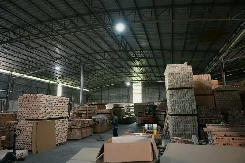 Wrapped timber bundles stacked in the warehouse