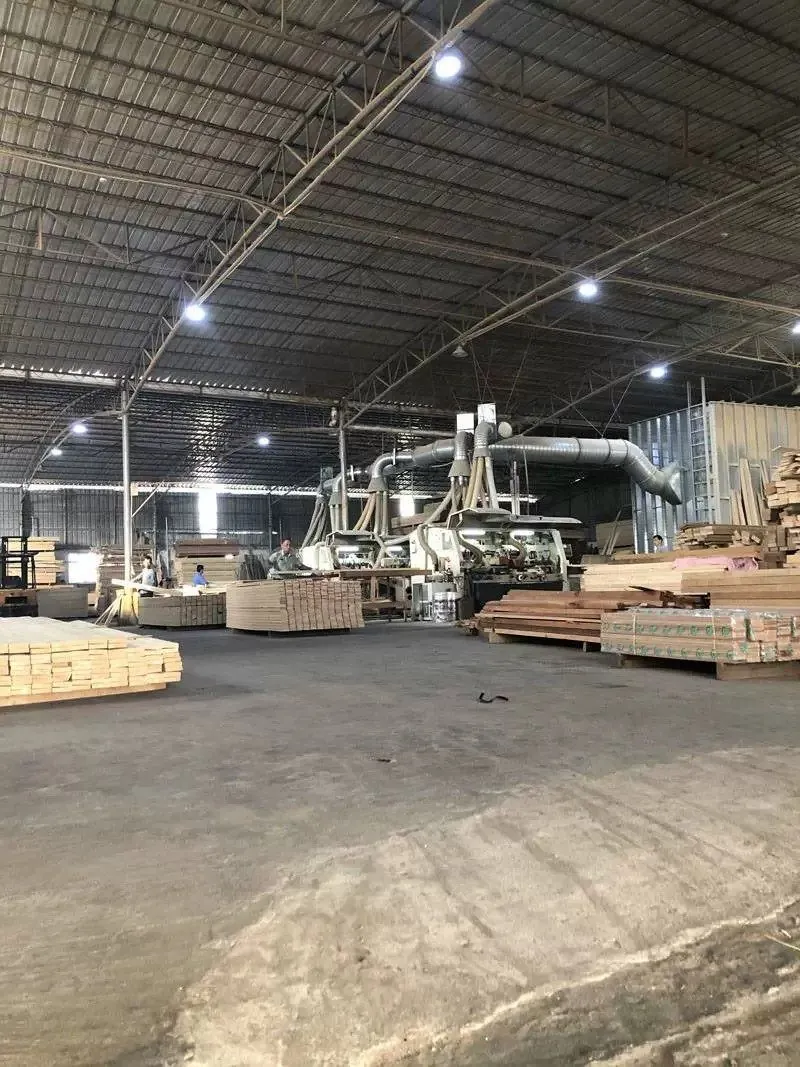 FENYA workshop floor with panel stacks, machining equipment and extraction ducting